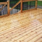 Freshly stained wooden deck with fencing and railing, Fencing and Decks