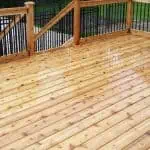 freshly stained wooden deck with fencing and railing, fencing and decks