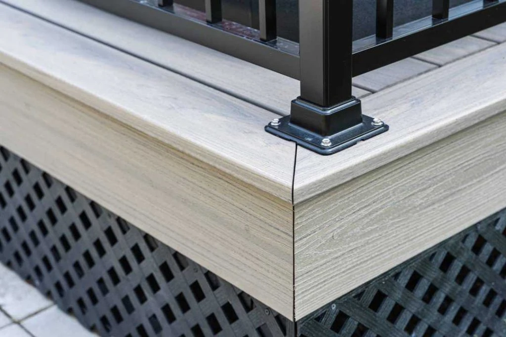 wooden bench with metal legs bolted to a concrete floor.