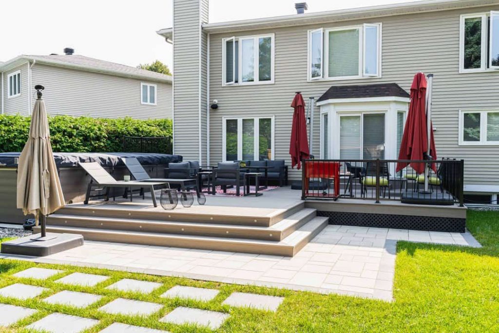 A backyard with a patio and chairs, ideal for relaxing or entertaining, fence contractors ottawa
