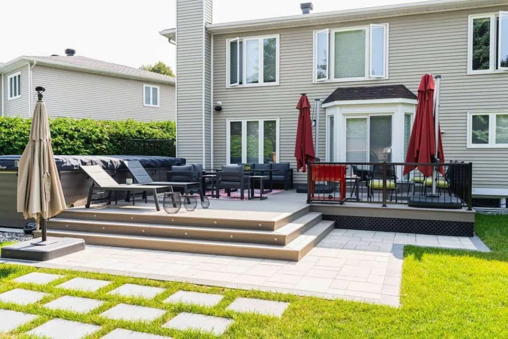a backyard with a patio and chairs, ideal for relaxing or entertaining, fence contractors ottawa