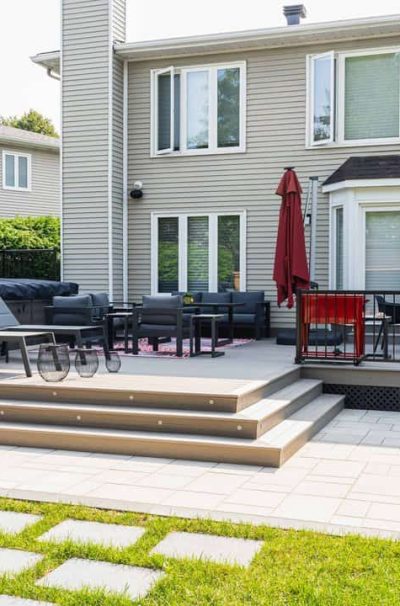 a backyard with a patio and chairs, ideal for relaxing or entertaining, fence contractors ottawa